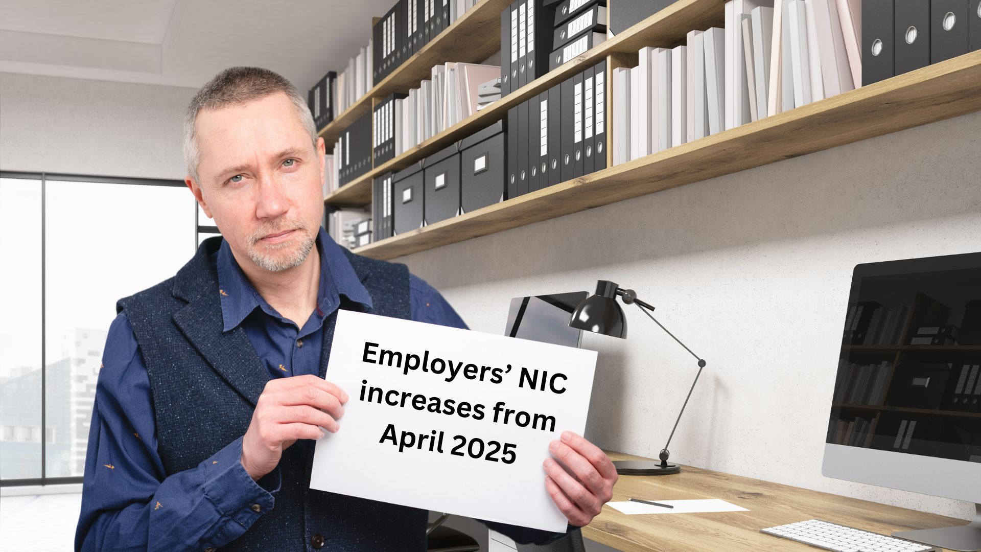 Team SAS holding a sheet of paper with 'Employers' NIC increases from April 2025'